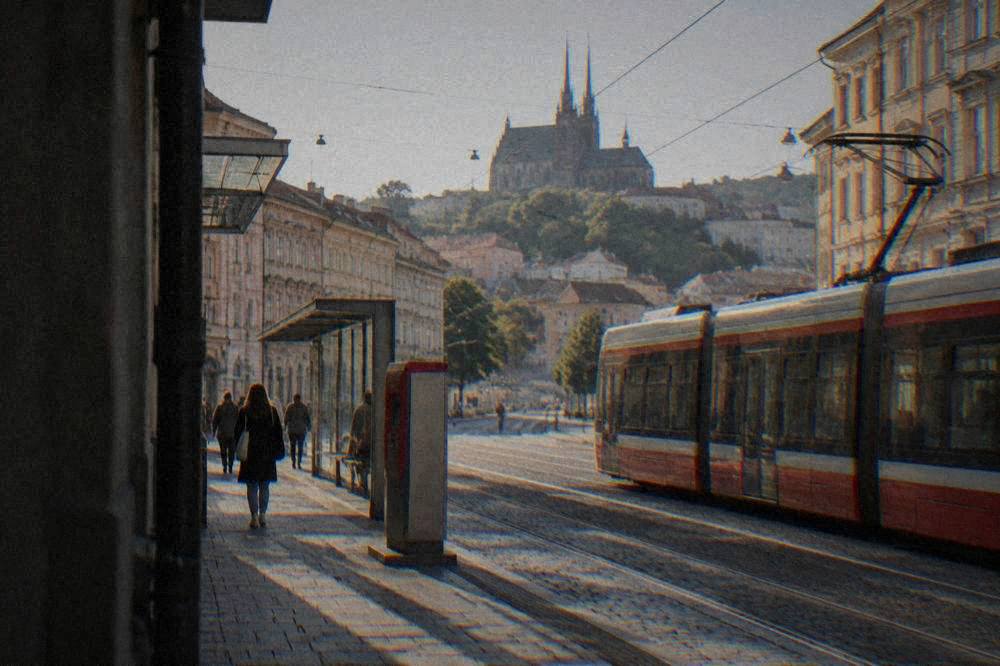 A tram stop in Brno with a ticket machine beside the platform