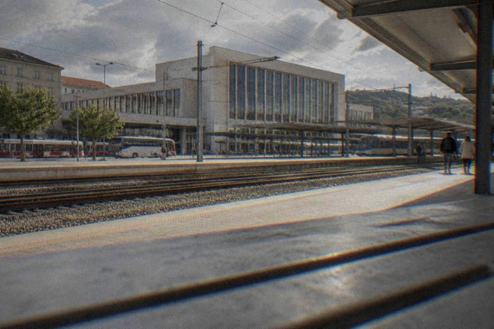 Sunlight on the platforms and tracks of a Czech main railway station in the morning