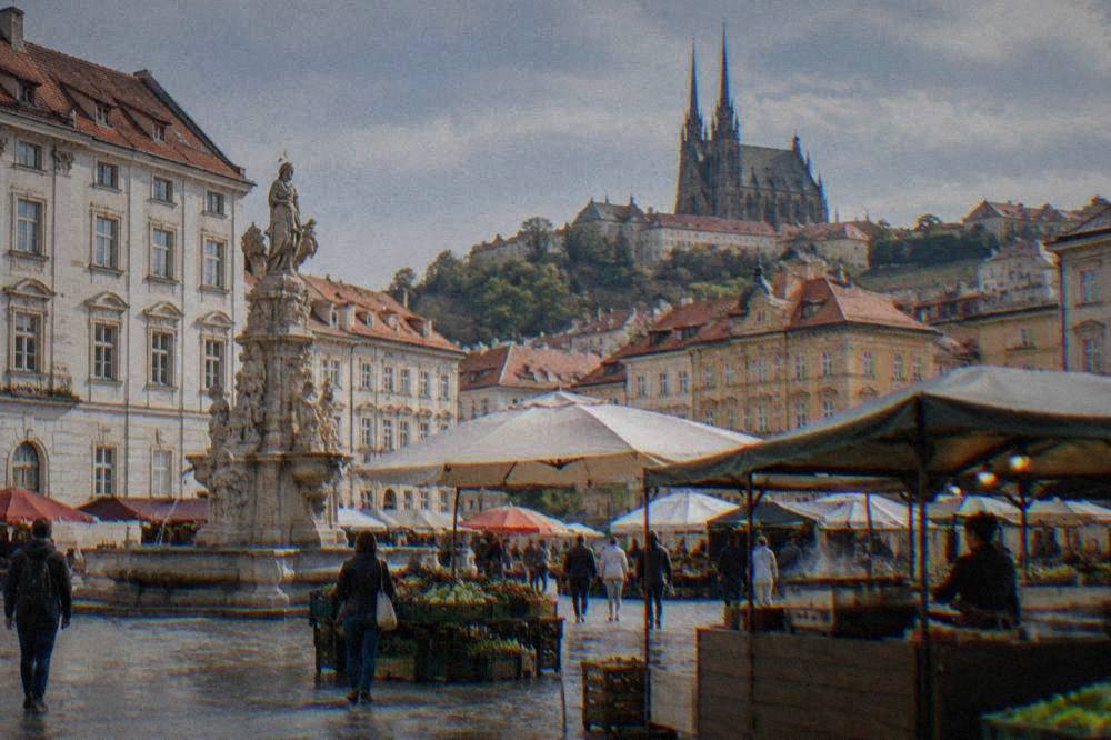 A street food stall and market umbrellas on the Cabbage Market square in central Brno