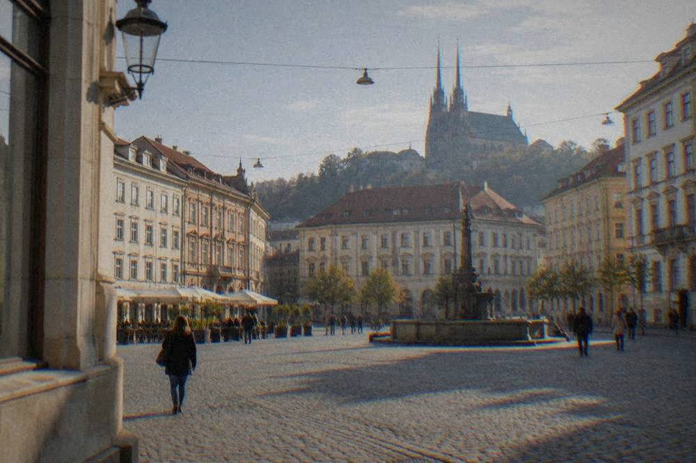 Historic buildings and a market square in central Brno on a bright day