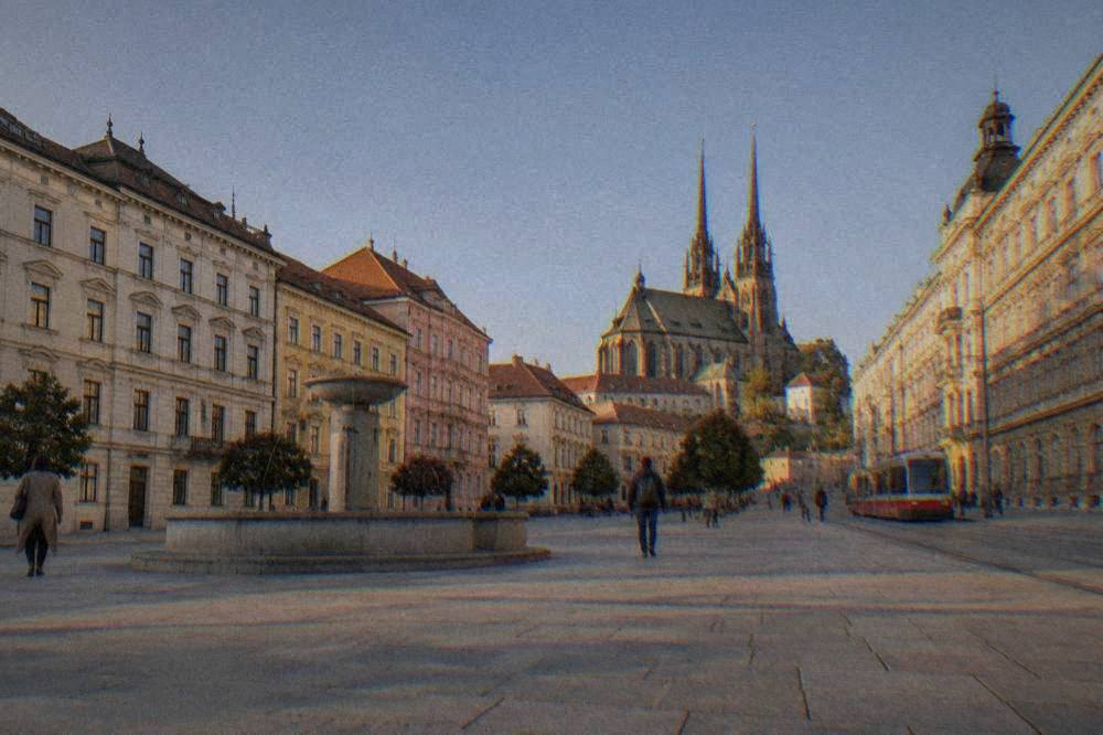 Evening light on the facades and statues of Freedom Square in central Brno