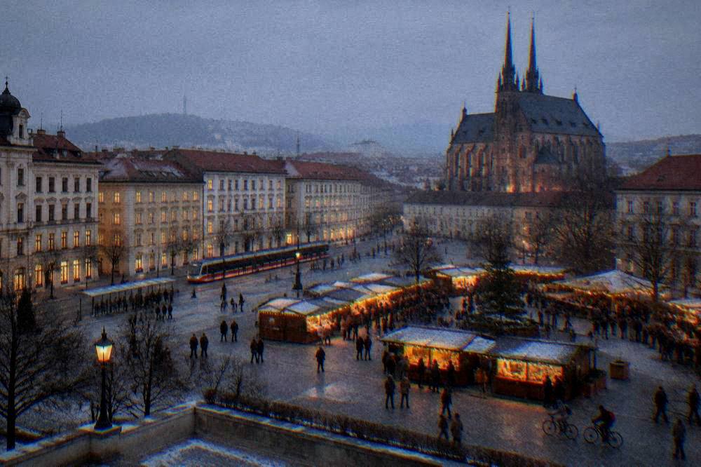 Evening market stalls with warm lights spread across a city square in winter