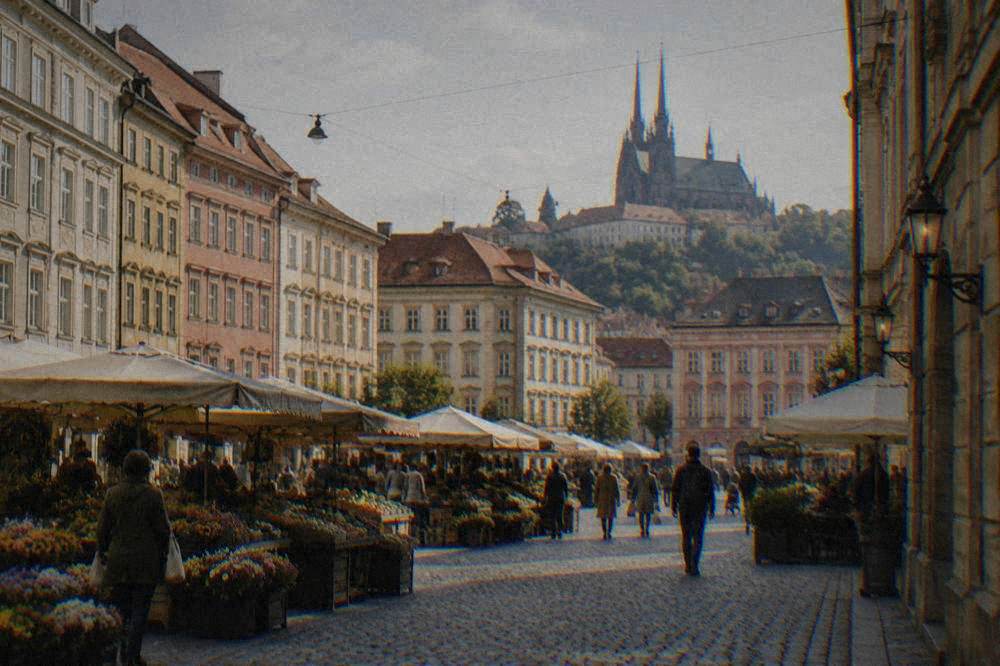 A cobbled square in Brno with a market and colourful facades