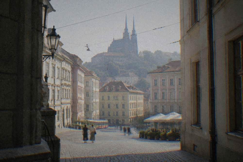 Gothic church tower rising above rooftops in Brno old town