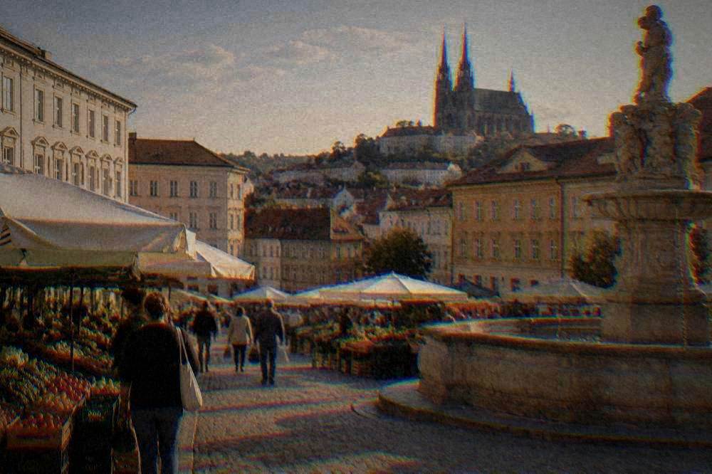 Open-air market stalls on a sloping square