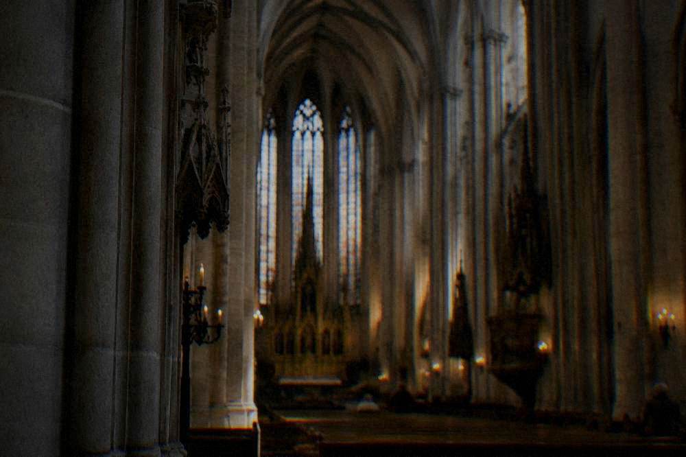 The interior nave of the Cathedral of Sts Peter and Paul with columns and vaulted ceiling