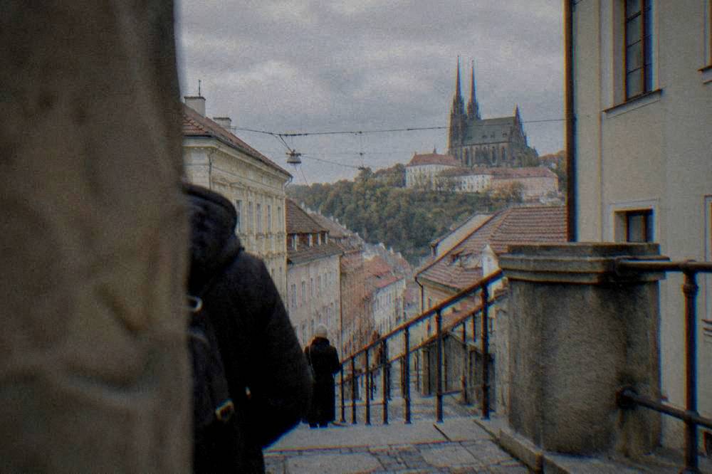 Stone steps and railing leading up one of the cathedral towers in Brno