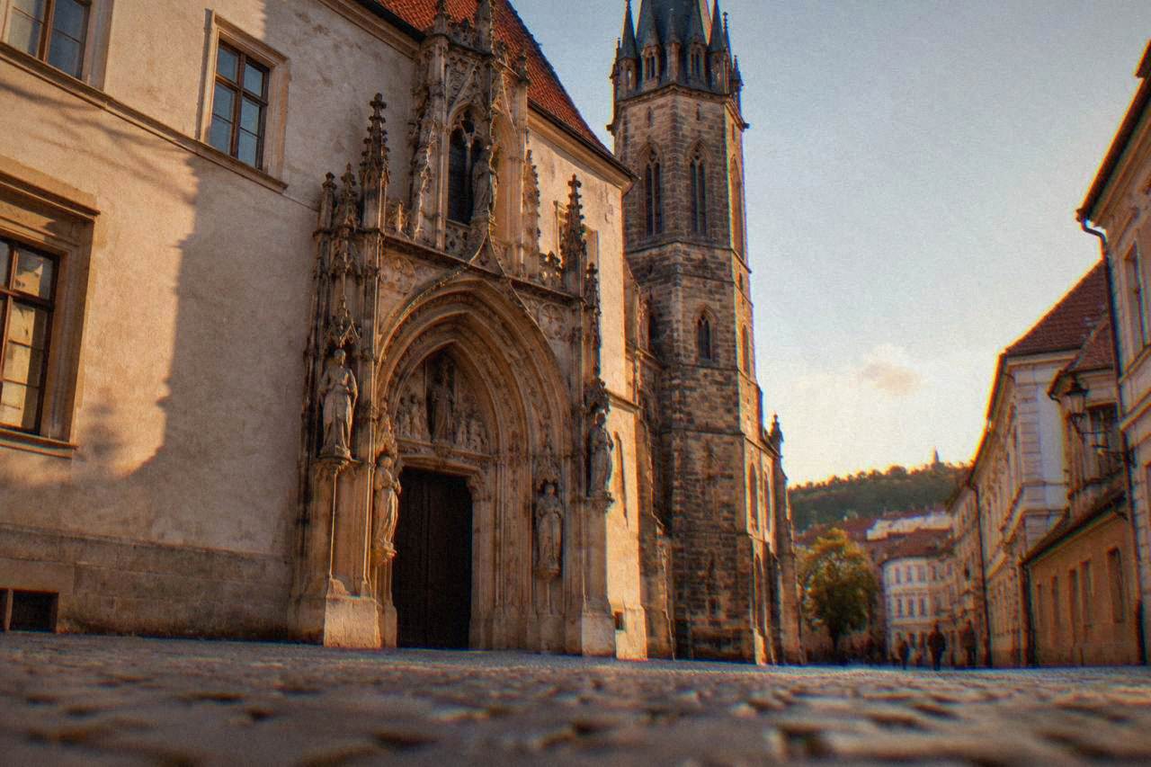 The entrance portal of the Old Town Hall in Brno with its carved figures and a narrow tower above