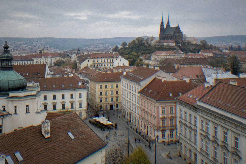 Rooftops of Brno old town seen from a tower with the cathedral spires in the distance