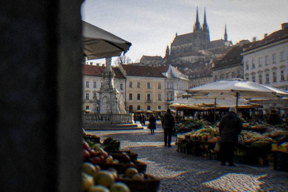 The Cabbage Market square in Brno with market stalls and historic buildings