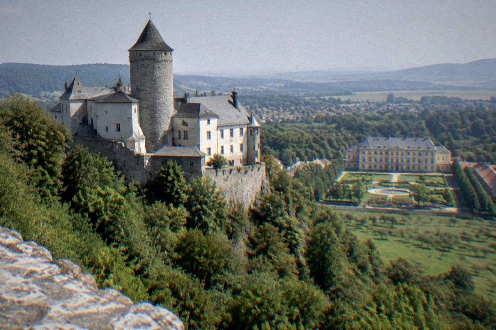 A chateau with a symmetrical facade and formal garden in the Moravian countryside