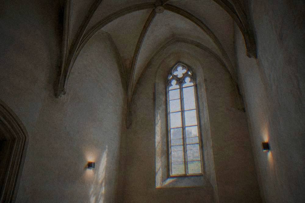 Interior of a small chapel decorated with arranged human bones forming chandeliers and ornaments