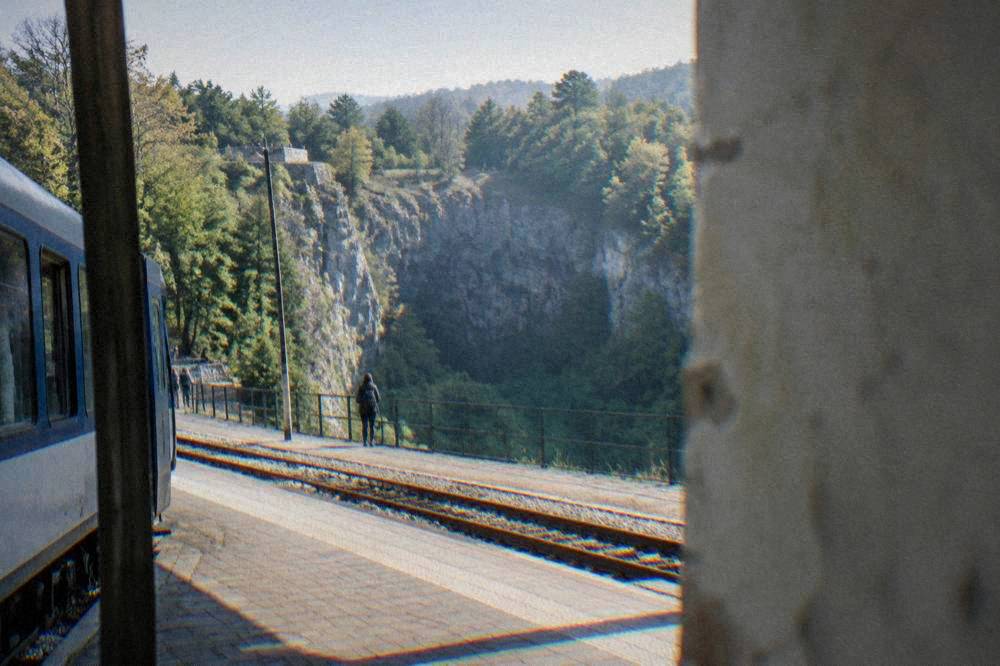 A regional train stopped at a small Czech station platform