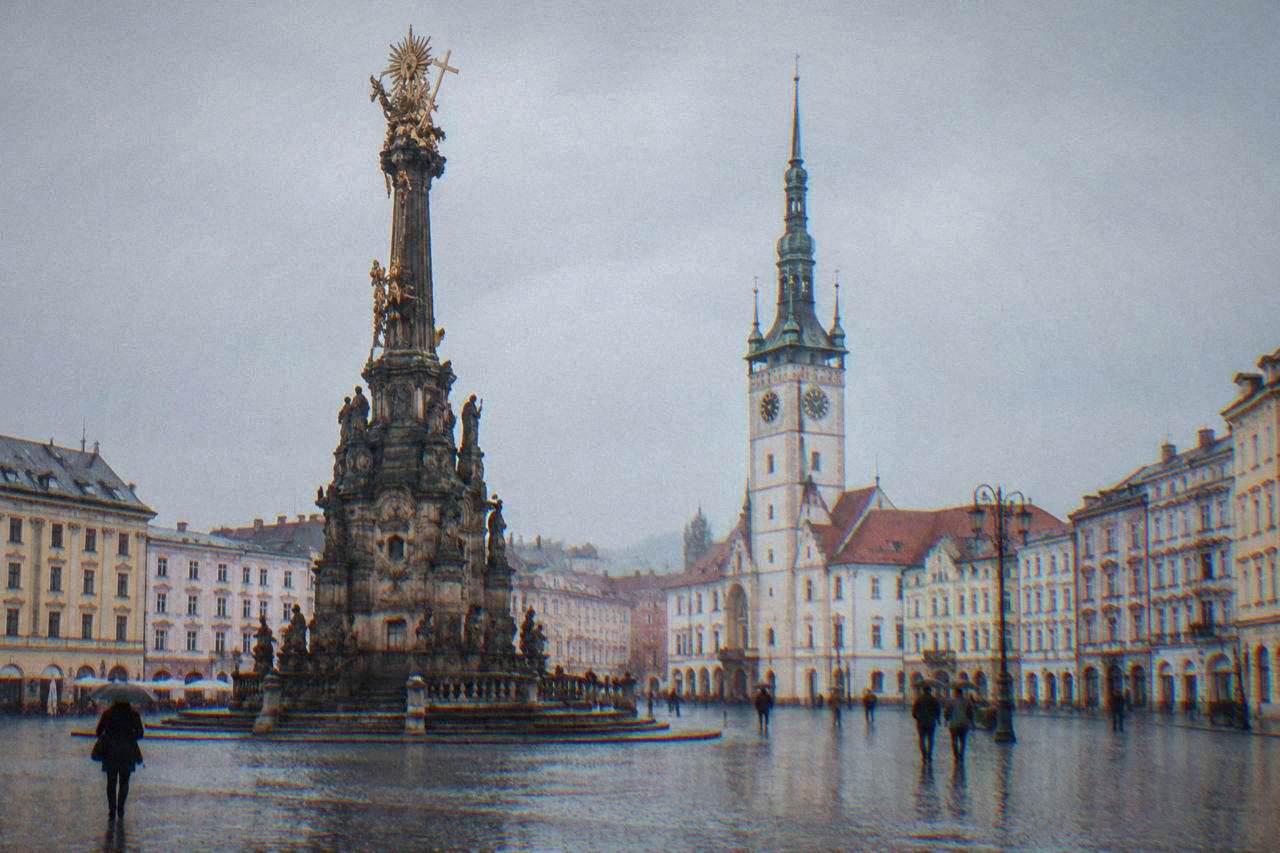Baroque Holy Trinity Column rising from a wide cobblestone square in Olomouc