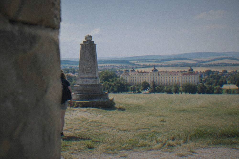 A stone memorial standing in a field near Slavkov u Brna