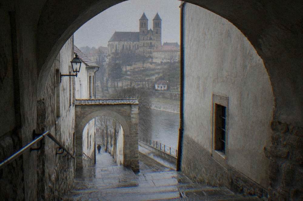 A stone archway and staircase between houses in the Jewish Quarter of Třebíč