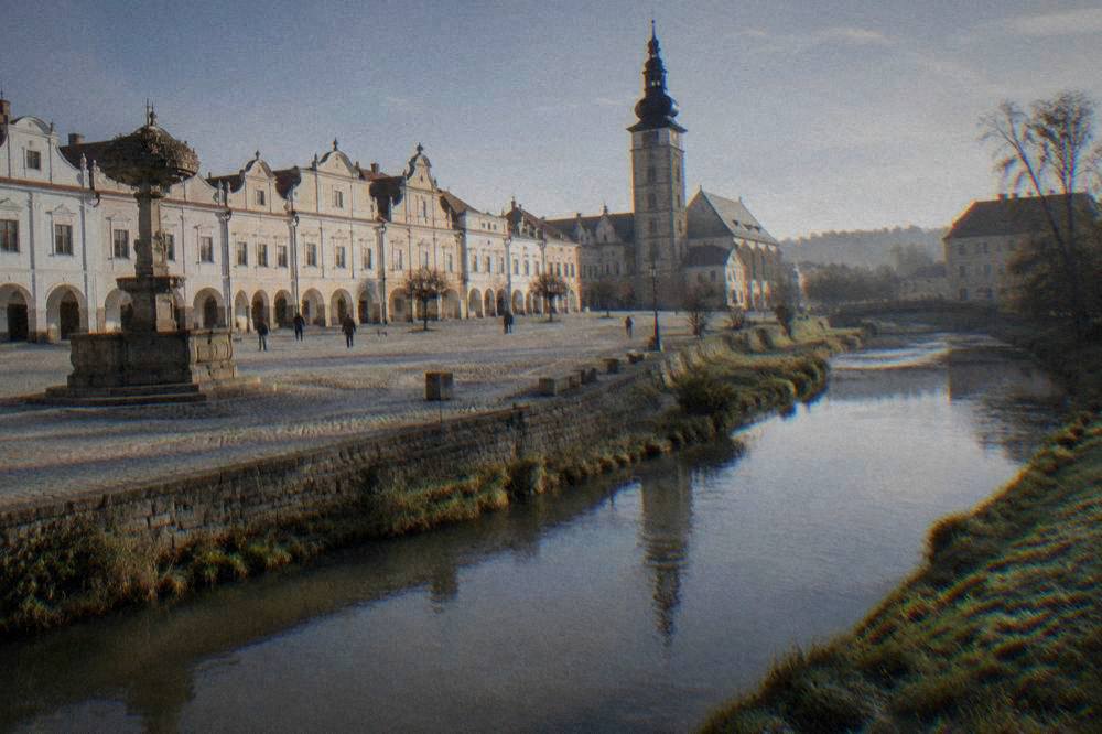 River Jihlava flowing past grassy banks near the Jewish Quarter in Třebíč