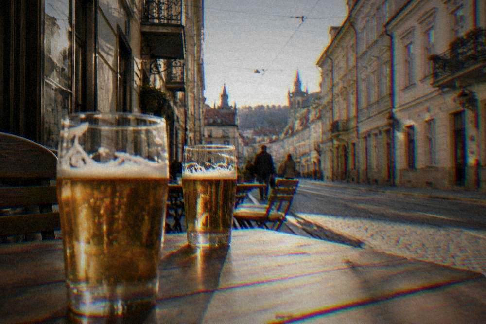 Glasses of lager on a wooden pub table