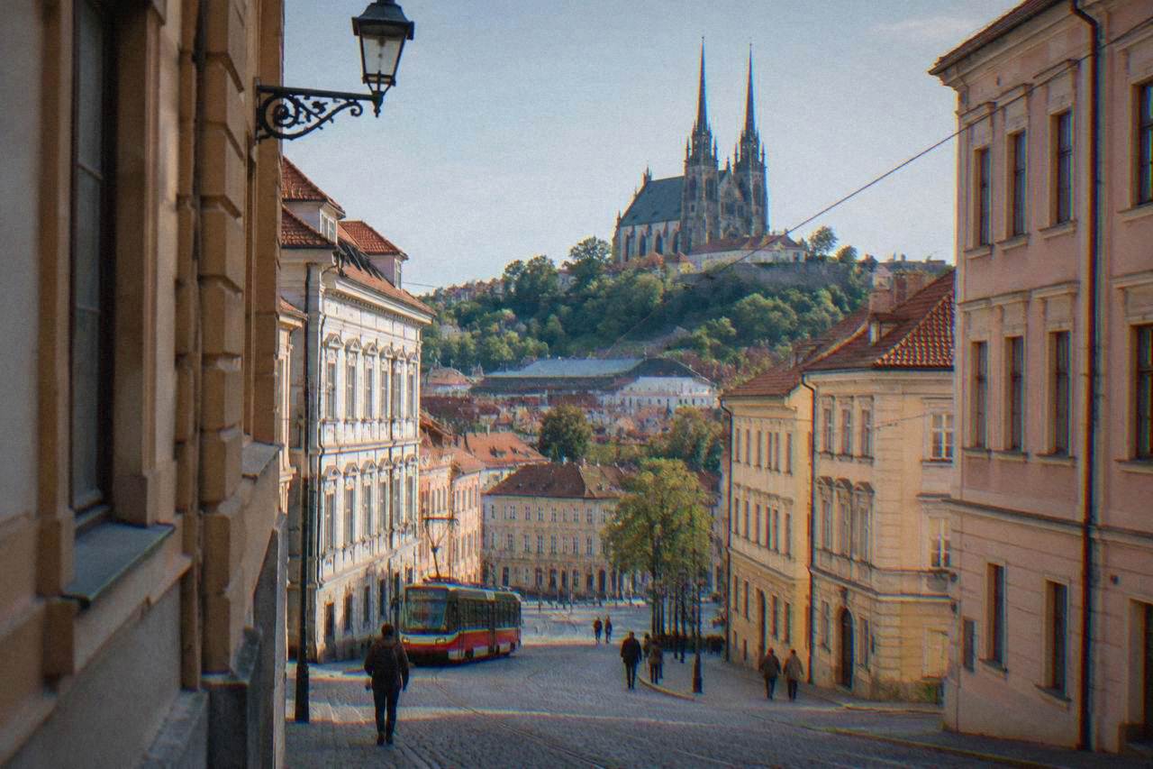 Twin spires of the Cathedral of Sts Peter and Paul rising above rooftops on Petrov Hill in Brno