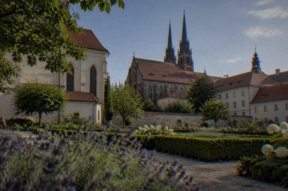 Gardens beside an abbey complex in Old Brno on a sunny day