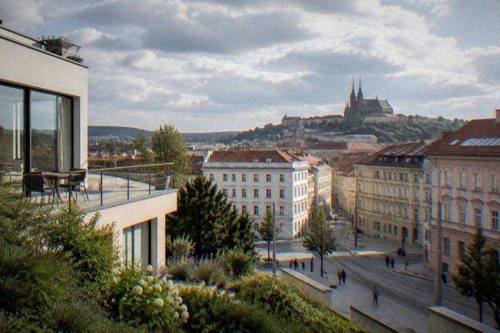 A modernist white villa with a garden terrace and large windows in Brno