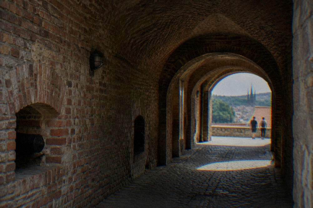 The dark arched brick corridors of the Špilberk Castle casemates in Brno