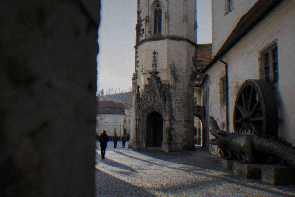 The Brno dragon crocodile and the large wooden wheel displayed in the Old Town Hall passage