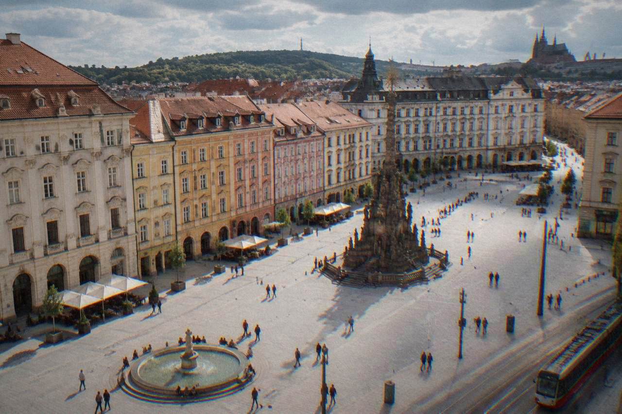 Brno's Freedom Square with the baroque plague column and pastel facades seen from above