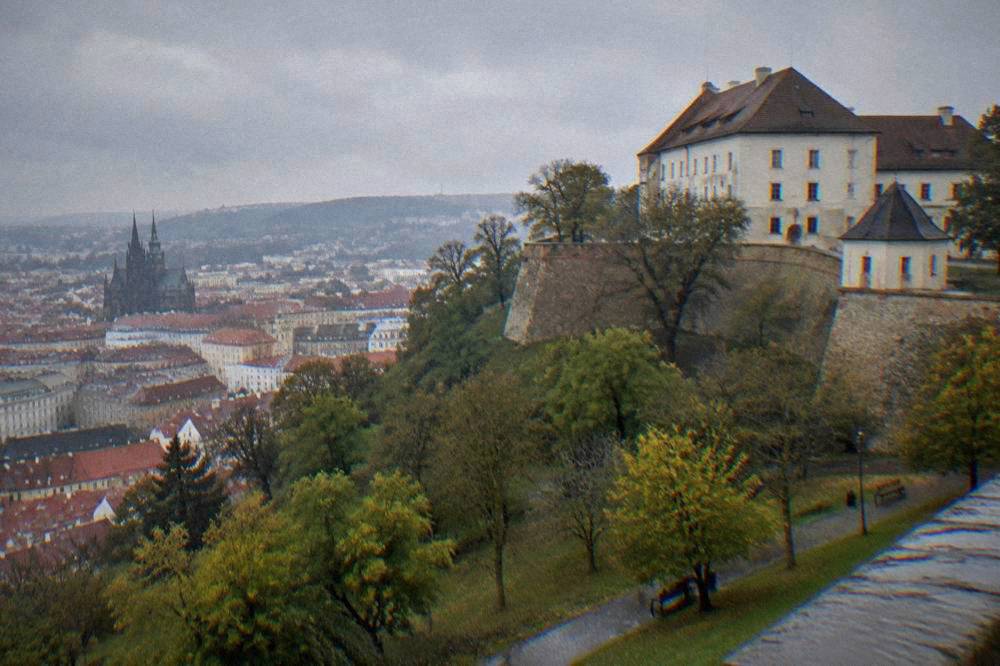 The fortress walls and park of Špilberk Castle above the rooftops of Brno