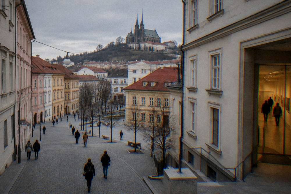 Visitors walking through a lit museum corridor in Brno