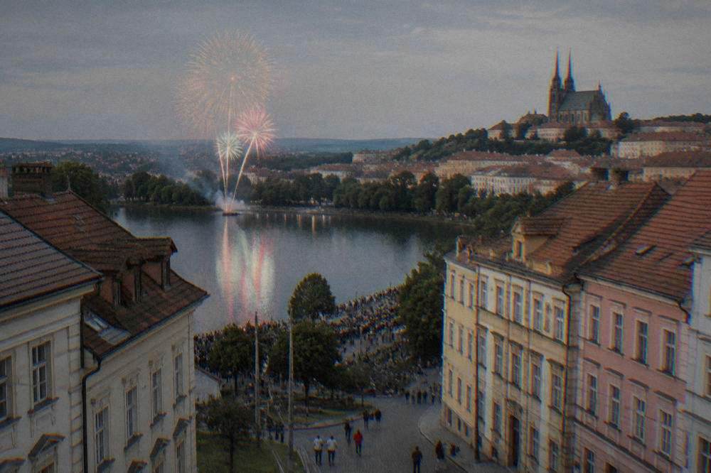 Fireworks bursting over a dark lake with crowds watching from the shore