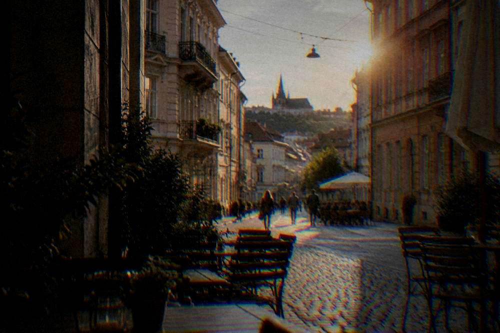 Outdoor tables on an old street in the evening