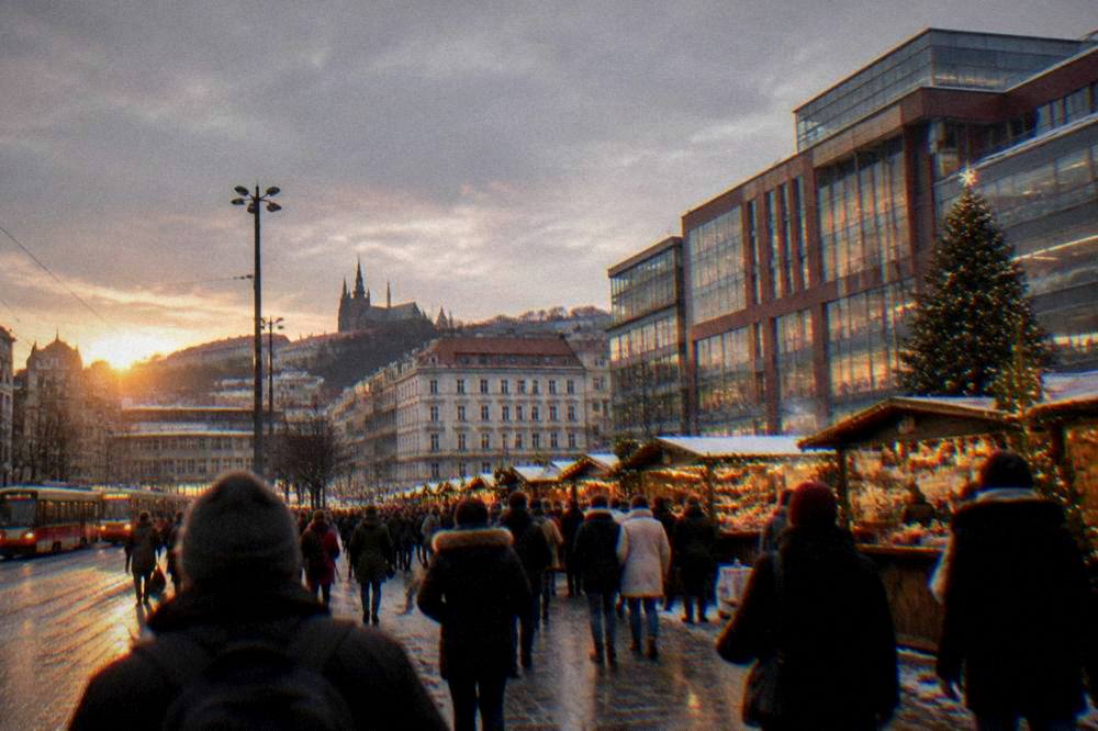 Crowds walking through a Christmas market on a city square at dusk