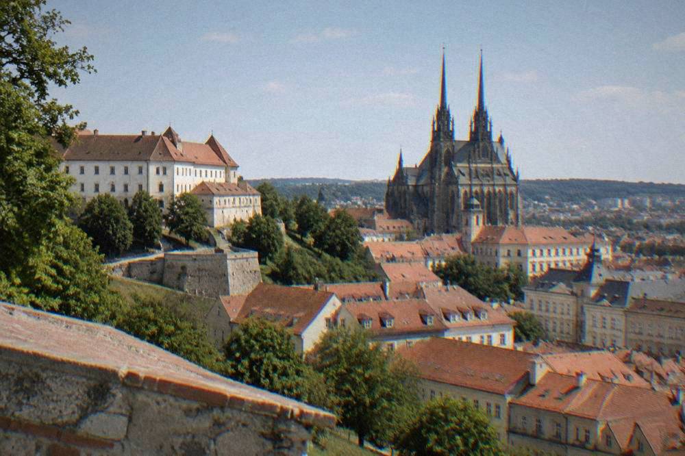 View over red rooftops toward the cathedral from an elevated Brno viewpoint