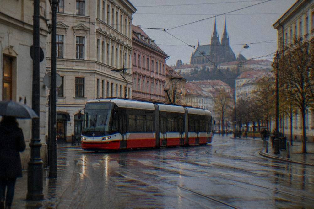 A tram crossing an intersection in Brno on a rainy day