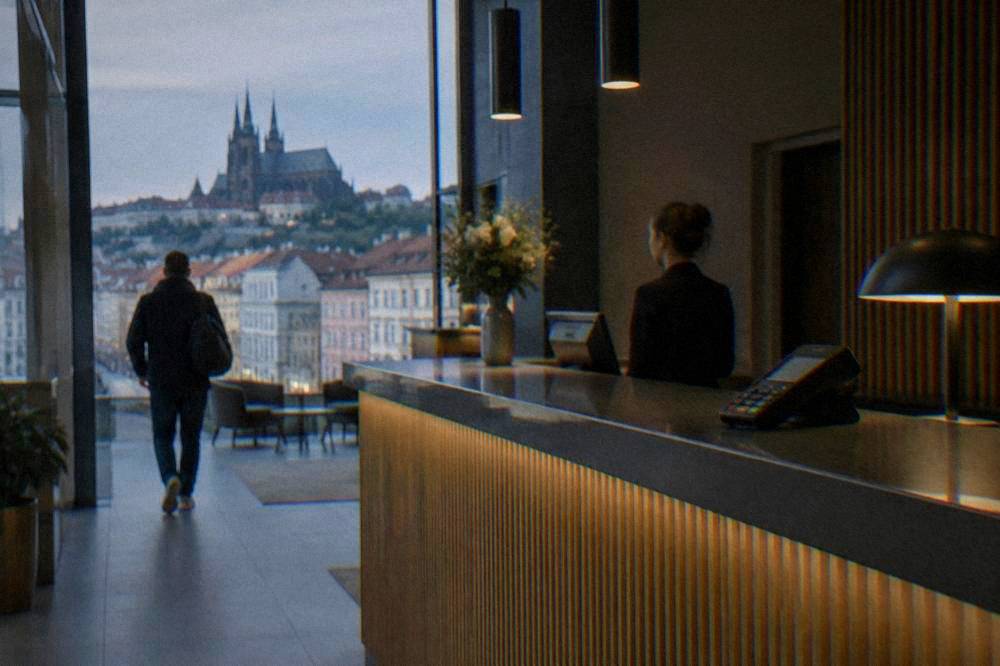 A hotel reception desk in Brno with a card reader