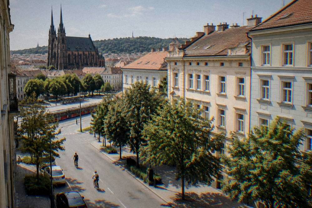A quiet tree-lined street of older apartment buildings near the abbey in Old Brno