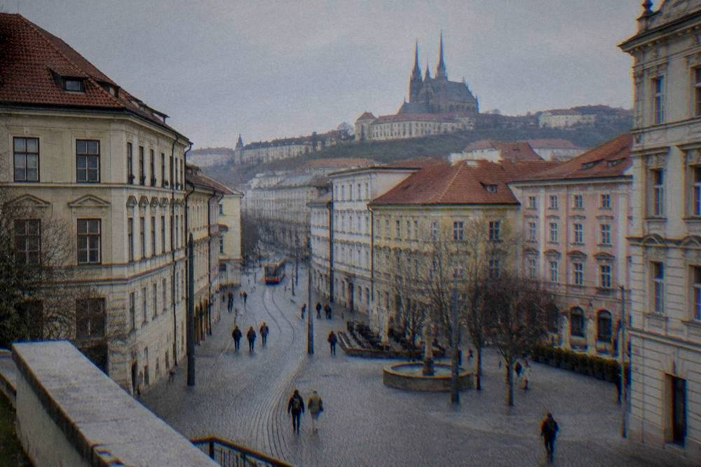 The twin spires of the Cathedral of Sts Peter and Paul seen over rooftops in Brno