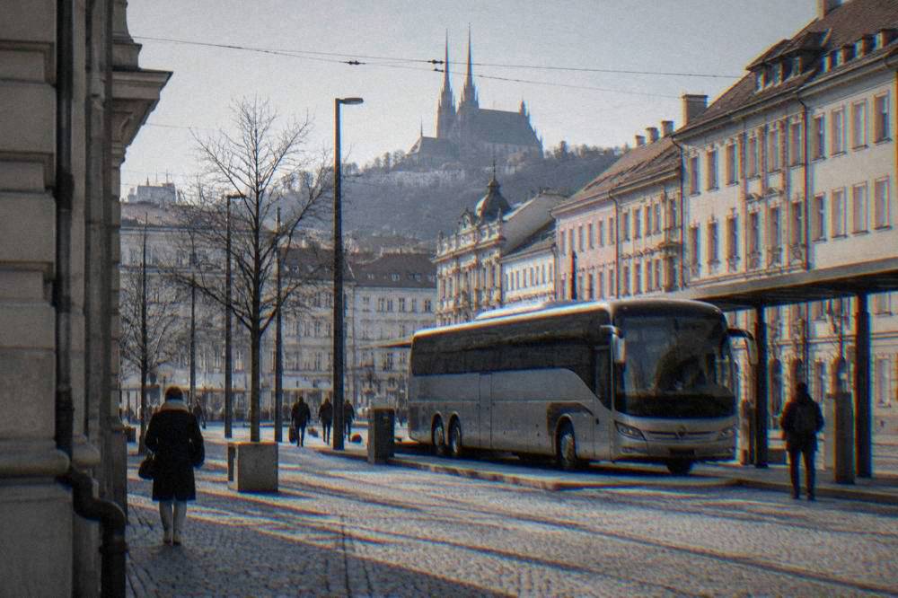 A modern long-distance coach parked at a bus terminal bay