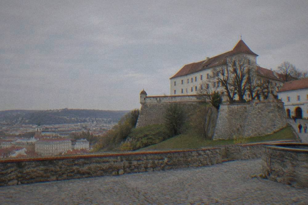 The stone walls and courtyard of Špilberk Castle on a hill above Brno