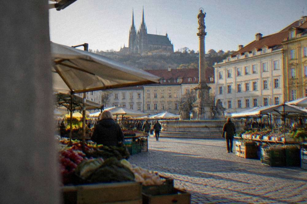 Market stalls and the historic column on the Cabbage Market square in Brno