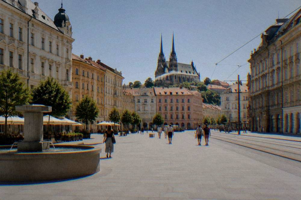 The twin spires of the Cathedral of Sts Peter and Paul on Petrov Hill seen from a city street