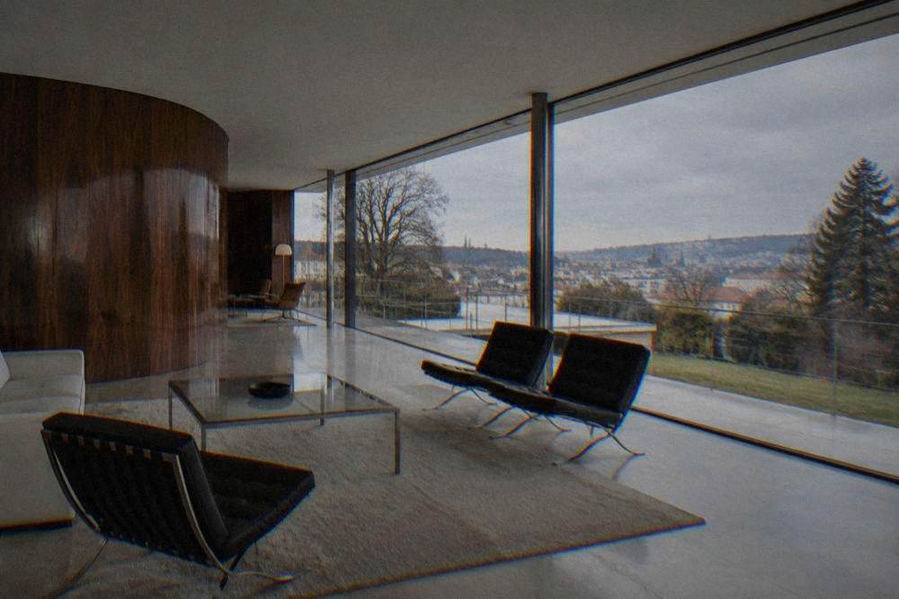 Modernist living room of Villa Tugendhat with a curved macassar wood partition and large windows