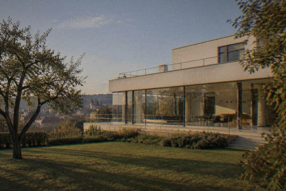 The glass-walled main living space of Villa Tugendhat looking onto its garden