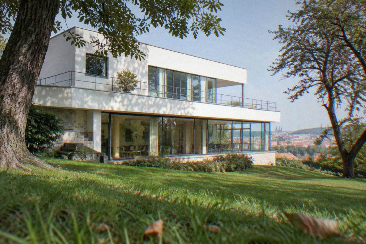 Villa Tugendhat seen from its garden, a pale modernist house with a flat roof and long horizontal windows