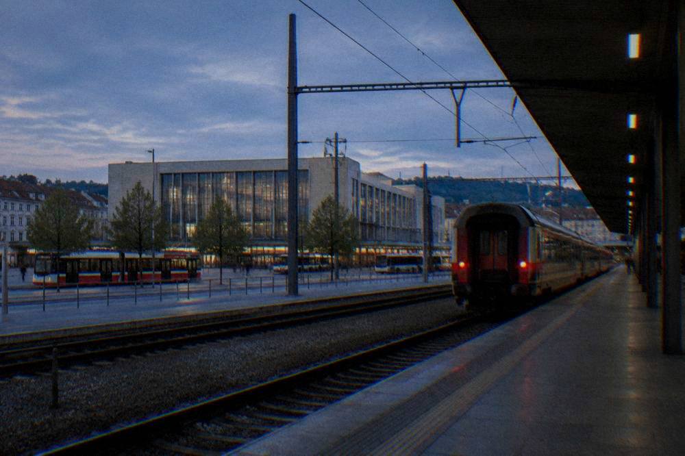 A train departing from the platform at Brno main railway station in the evening