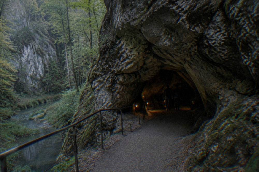 Entrance to a show cave in the Moravian Karst with a path leading into the rock